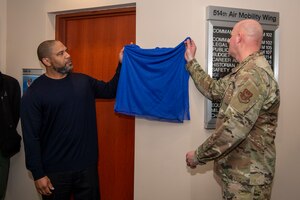 The 514th Air Mobility Wing unveiled a plaque dedication for Chief Master Sgt. Corinne E. Aimable at the 514th AMW Wing headquarters at Joint Base McGuire-Dix-Lakehurst, New Jersey, March 2, 2024. In attendance at the plaque dedication were members of the Aimable family and many Airmen who consider themselves blessed to have had the chief as a mentor and as a friend. Aimable was laid to rest on July 18, 2023, after a two-year battle with cancer.