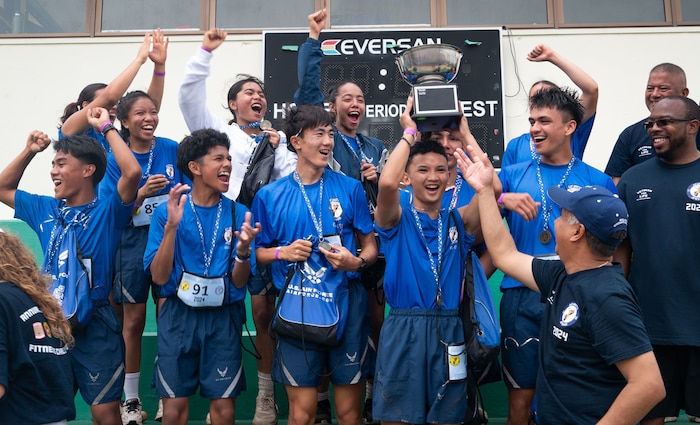 U.S. Air Force Junior Reserve Officer Training Corps cadets from John F. Kennedy High School, Guam, cheer after winning the 3rd annual JROTC Fitness Challenge hosted in Tamuning, Guam, Feb. 24, 2024. The Guam JROTC Fitness challenge was created by Senior Enlisted Airmen from Andersen Air Force Base, Guam. This event hosted seven schools with two teams each. Although there were winners for the challenge, the ultimate goal of the challenge is to allow active duty members who volunteered to mentor the cadets on the importance of physical excellence. (U.S. Air Force photo by Staff Sgt. Pedro Tenorio)