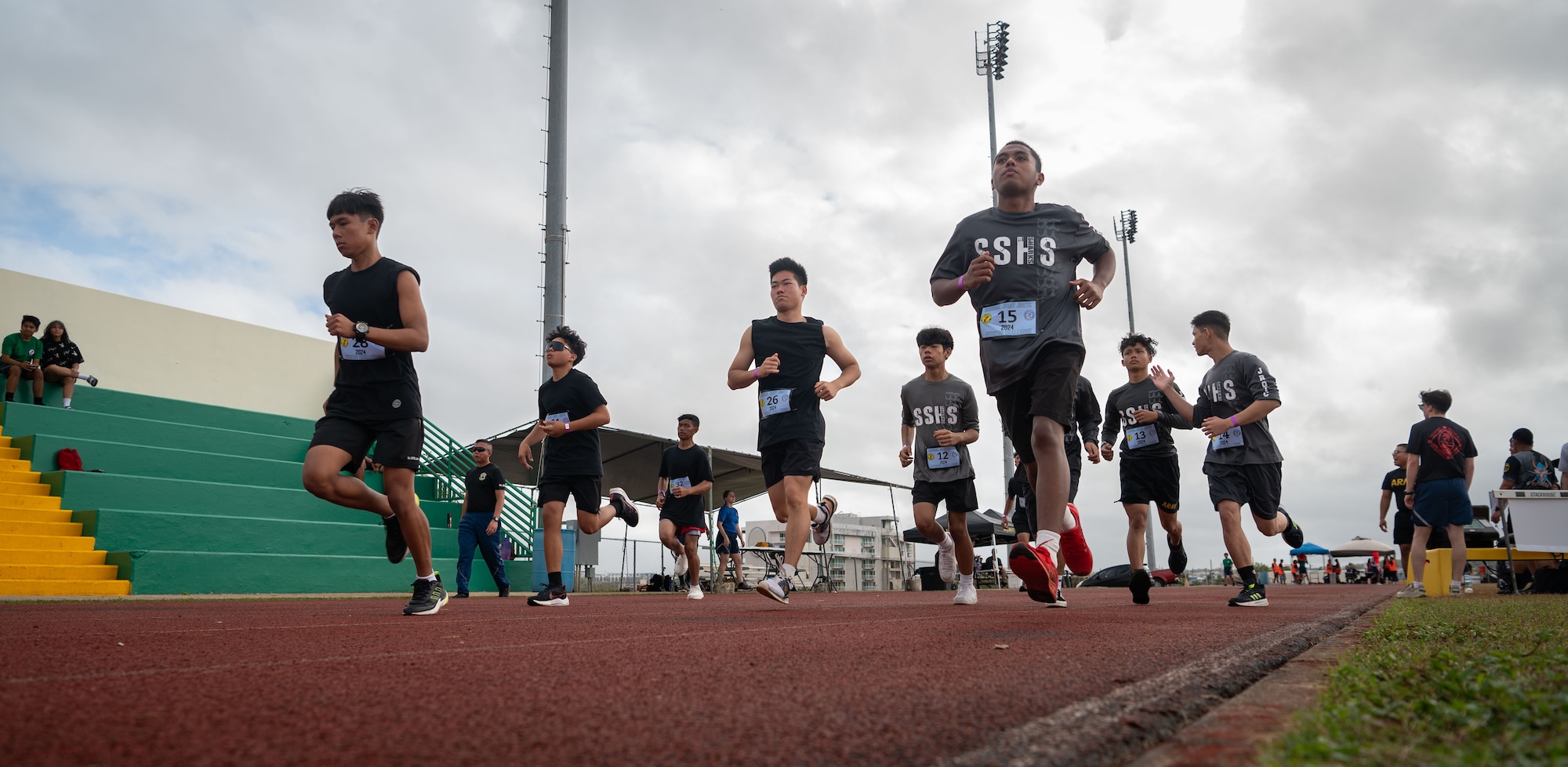 Cadets from various Guam High School Junior Reserve Officer Training Corps participate in a mile run during the 3rd annual Guam JROTC Fitness Challenge hosted at John F. Kennedy High School, Guam, Feb. 24, 2024. The Guam JROTC Fitness Challenge was created by Senior Enlisted Airmen from Andersen AFB after they saw the national rise of cadets losing full ROTC scholarships due to failure of fitness standards. This challenge was made to combine both friendly competition and mentorship for these cadets. (U.S. Air Force photo by Staff Sgt. Pedro Tenorio)