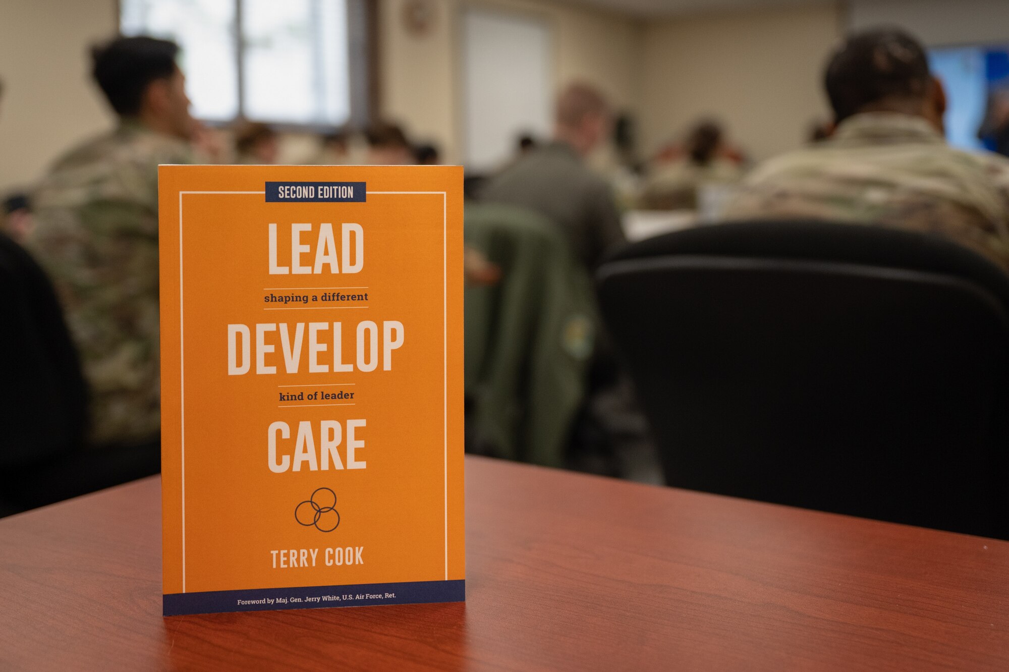 A “Lead, Develop, Care” book sits on a desk at Osan Air Base, Republic of Korea, Feb. 27, 2024. An LDC workshop was taught to members of the 51st Fighter Wing, providing them with a practical framework for leadership to bring back to their units. Developing innovative leaders with resources like LDC keeps the 51st FW ready to “Fight Tonight.” (U.S. Air Force photo by Senior Airman Brittany Russell)