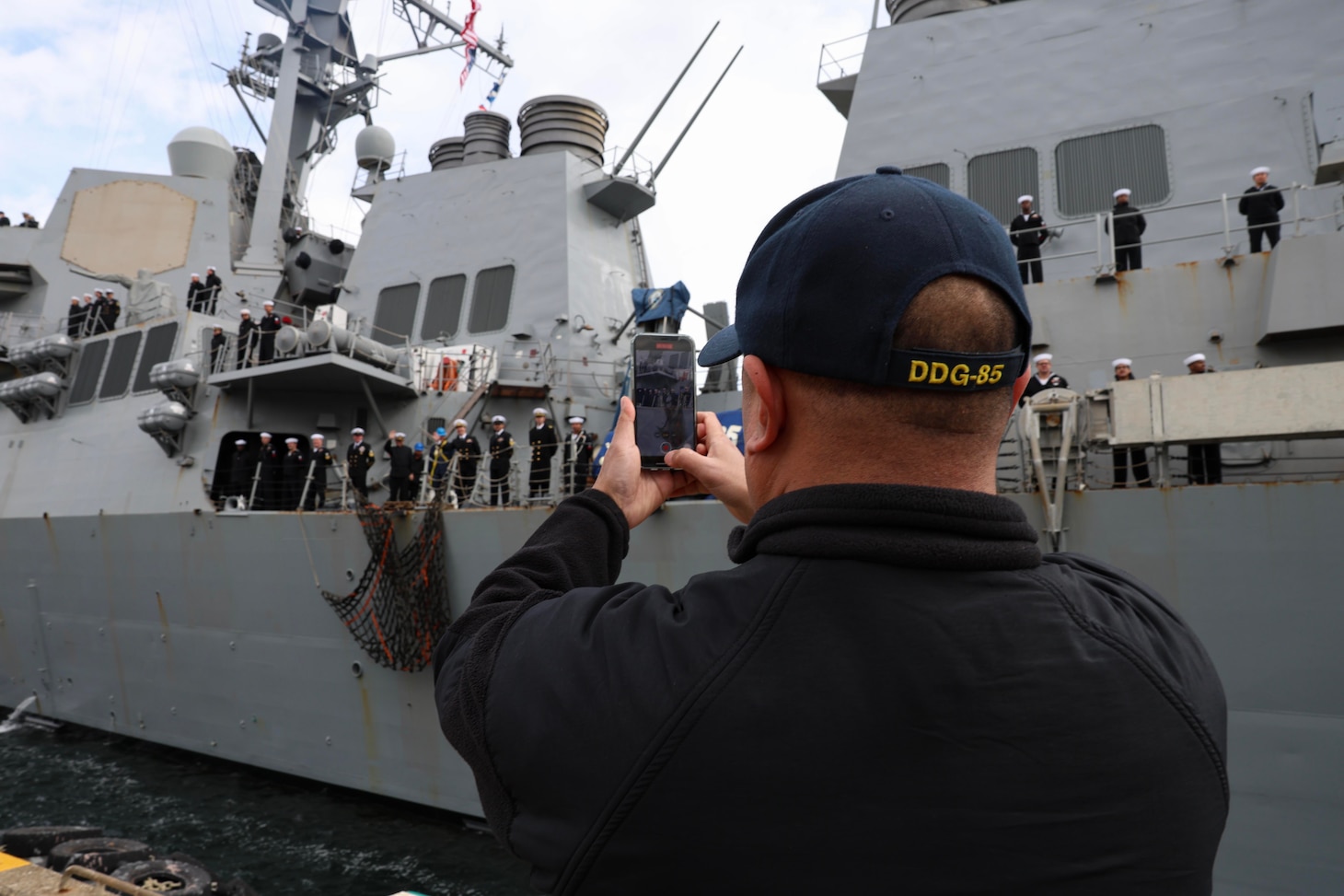 YOKOSUKA, Japan (March 2, 2024) – Senior Chief Culinary Specialist Lemuel Manlogon, from Quezon City, Philippines, takes a photo as the Arleigh Burke-class guided-missile destroyer USS McCampbell (DDG 85) returns to Commander, Fleet Activities Yokosuka, March 2, after a 17-month Depot Modernization Period in Portland, Oregon. McCampbell is forward-deployed and assigned to Destroyer Squadron (DESRON) 15, the Navy’s largest DESRON and the U.S. 7th Fleet’s principal surface force. (U.S. Navy photo by Mass Communication Specialist 1st Class Greg Johnson)