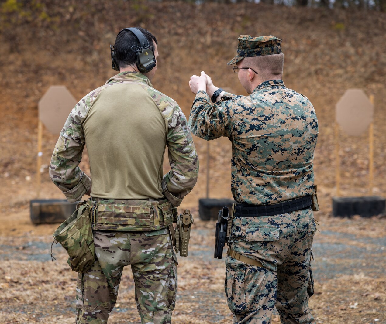 A British Royal Marine conducts shooting drills with the Marine Corps Shooting Team during Operation Longshot at the pistol range on Marine Corps Base Quantico, Feb. 28, 2024. Operation Longshot exchanges service members from the two countries to share shooting techniques, evaluate each member’s skillset, and builds report amongst the two services. (U.S. Marine Corps photo by Lance Cpl. Ethan Miller)