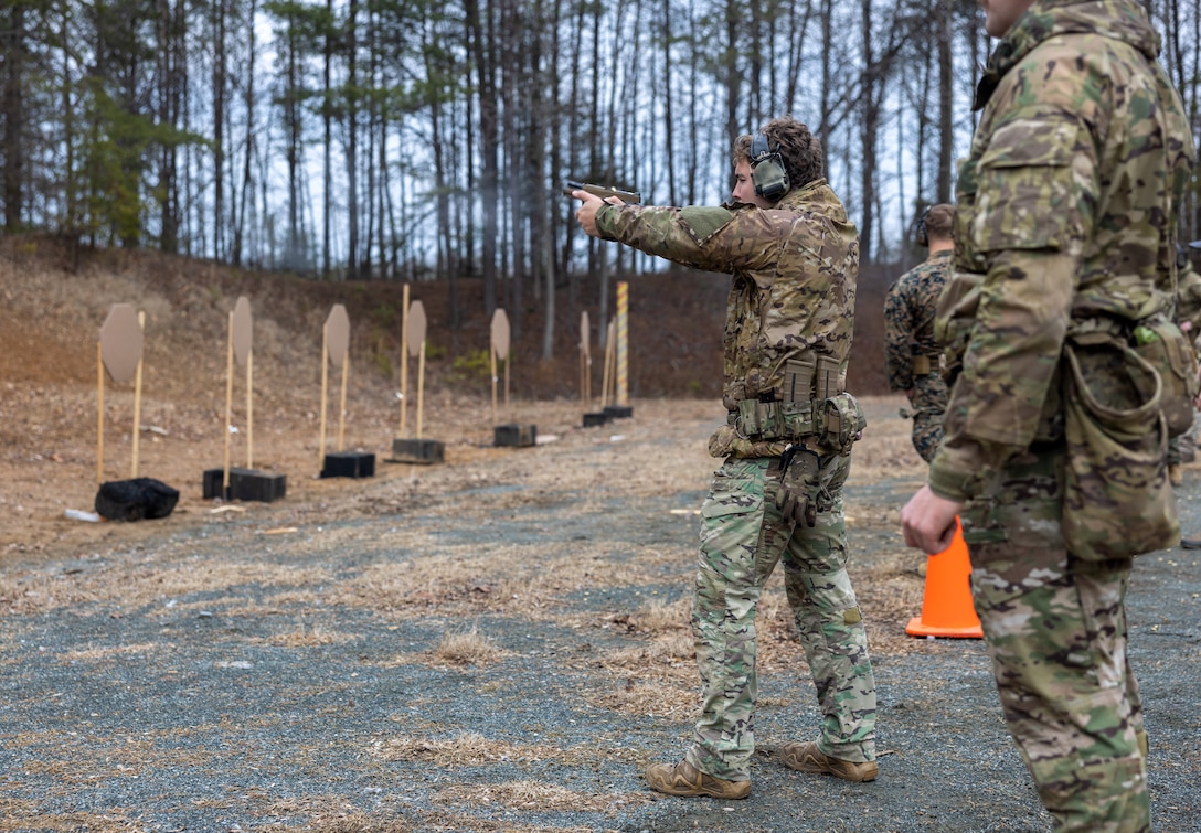 British Royal Marines conduct shooting drills with the Marine Corps Shooting Team during Operation Longshot at the pistol range on Marine Corps Base Quantico, Feb. 28, 2024. Operation Longshot exchanges service members from the two countries to share shooting techniques, evaluate each member’s skillset, and builds report amongst the two services. (U.S. Marine Corps photo by Lance Cpl. Ethan Miller)