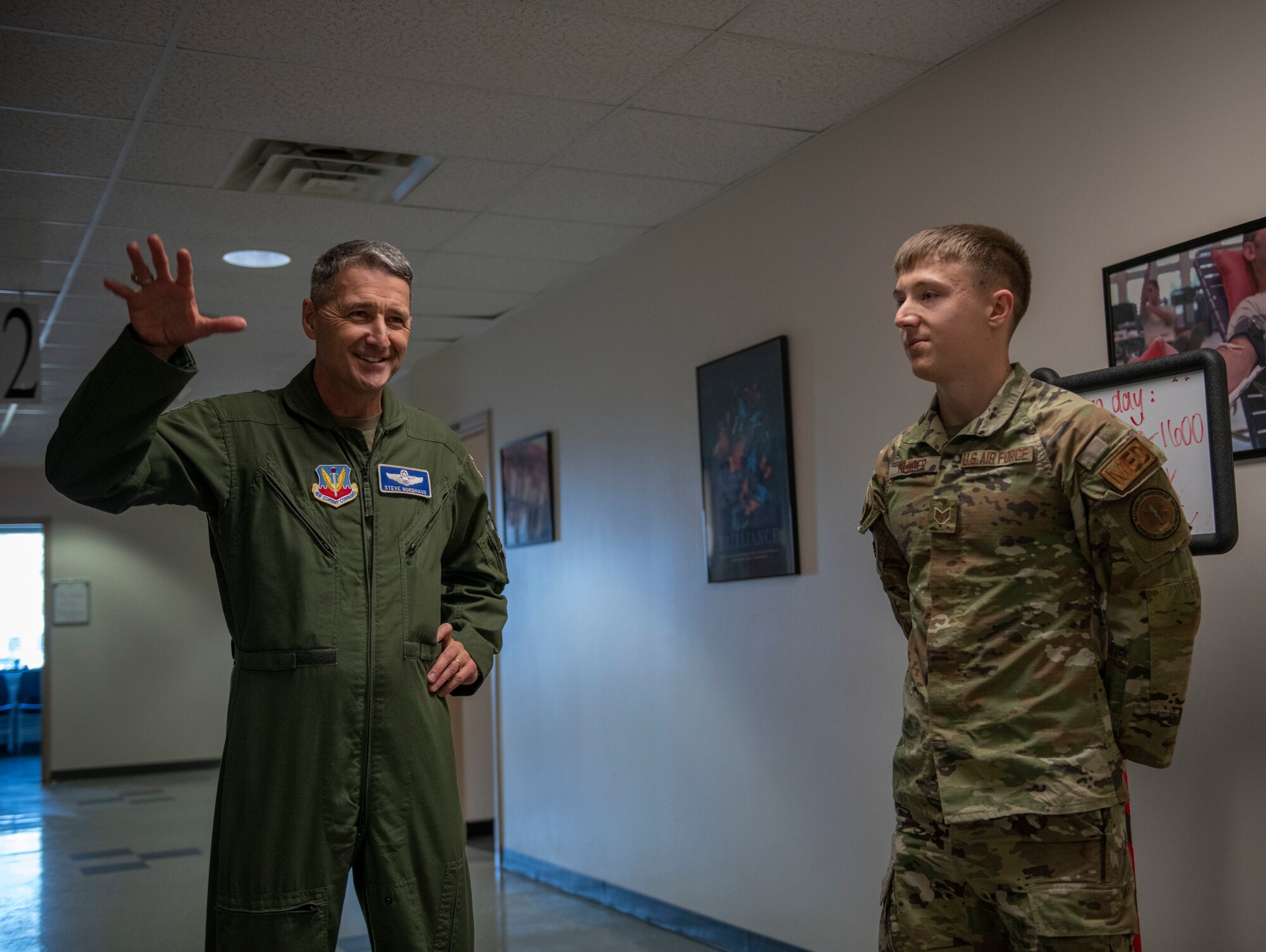 U.S. Air Force Lt. Gen. Steven S. Nordhaus, 1st Air Force commander, presents a challenge coin to U.S. Air Force Staff Sgt. Colton Munger, an aerospace medical technician, assigned to the Ohio National Guard’s 180th Fighter Wing, during a visit with the 180FW Medical Group, in Swanton, Ohio, Feb. 1, 2024. Munger was coined for his exemplary performance within the Medical Group, maintaining the highest levels of proficiency and readiness. (U.S. Air National Guard photo by Airman 1st Class Nicholas Battani)