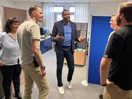 Larry Wright is the chief of supply and services at Logistics Readiness Center Wiesbaden. He said his division and the entire LRC Wiesbaden team are consummate professionals, and their number one objective every day is readiness. Pictured here, Wright (center) and his team discuss operations. (U.S. Army courtesy photo)