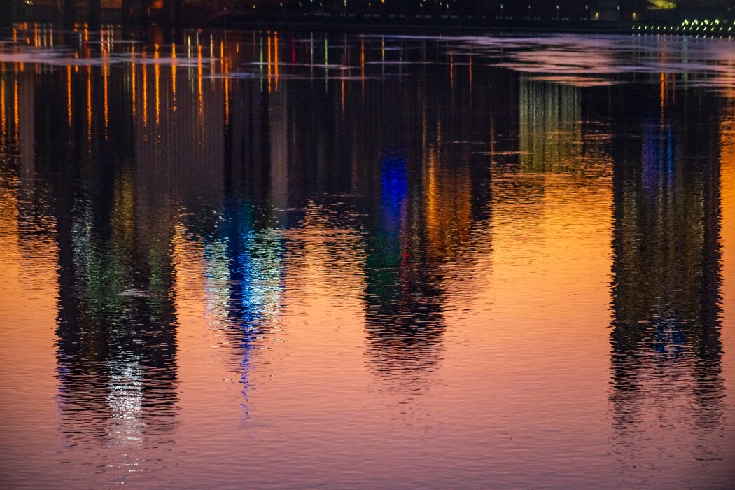 Towboats moving barges on the Ohio River in Pittsburgh at sunrise.