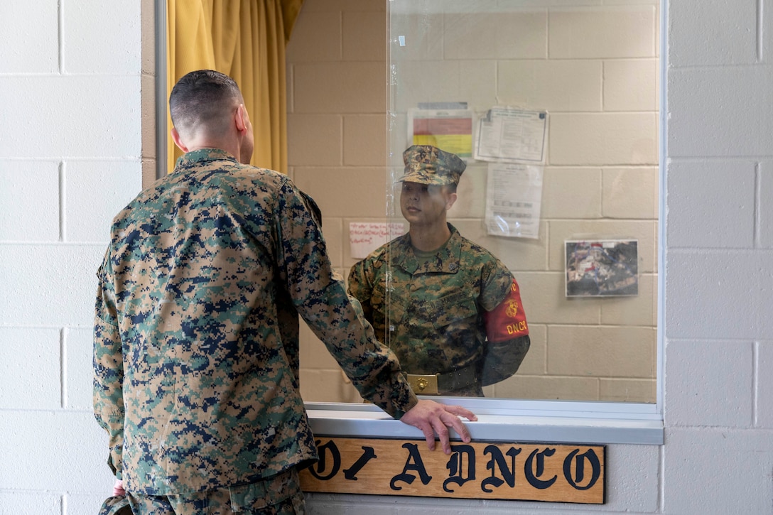 Sergeant Major of the Marine Corps Carlos A. Ruiz speaks to a Marine on duty during a tour of the enlisted barracks during a visit to Marine Forces Special Operations Command at Camp Lejeune, North Carolina, Feb. 21, 2024. Ruiz toured MARSOC to learn more about its mission and capabilities and took time to meet with enlisted Marines to discuss his plans for improving quality of life across the Corps.  (U.S. Marine Corps photo by Cpl. Henry Rodriguez)