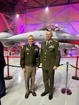 Indiana National Guard Maj. Gen. Dale Lyles, Indiana adjutant general, and Brig. Gen. Slavomir Staviarsky, a Slovak Republic defense attaché, pose in front of F-16s at a ceremonial delivery event in Greenville, South Carolina, Feb. 29, 2024.