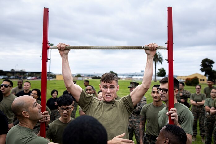 U.S. Marine Corps Cpl. Isaac Rogers, a finance technician, with Headquarters and Service Battalion, competes in the pull-up event during the atlas games at Marine Corps Recruit Depot San Diego, California, Feb. 29, 2024. The Atlas Games is an annual battalion field meet that incorporates leadership skills and teamwork to enhance individual readiness, unit cohesion, boost morale, and foster esprit de corps among Marines. (U.S. Marine Corps photo by Sgt. Yvonna Guyette)