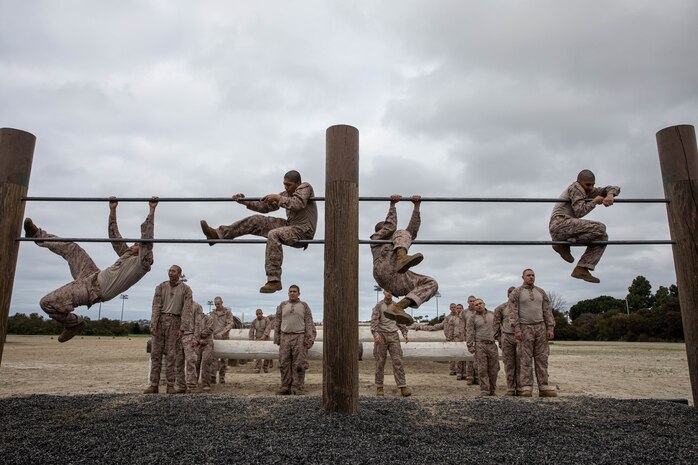 U.S Marine Corps recruits with Kilo Company, 3rd Recruit Training Battalion, participate in an obstacle course training event at Marine Corps Recruit Depot San Diego, California, Feb. 29, 2024. The o-course includes obstacles that recruits must overcome to enhance strength, agility, and confidence. (U.S. Marine Corps photo by Lance Cpl. Sarah M. Grawcock)