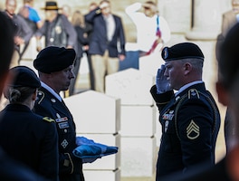 U.S. Army Staff Sgt. Dylan Wheeler, a cavalry scout assigned to the 1st Infantry Division, salutes the Medal of Honor Flag during Capt. Larry L. Taylor’s memorial service at the Chattanooga National Cemetery in Chattanooga, Tennessee, on Feb. 7, 2024. Taylor flew into enemy fire to rescue a four-man long-range reconnaissance patrol team, which went on to earn him the nation’s highest honor - the Medal of Honor. (U.S. Army photo by Spc. Dawson Smith)
