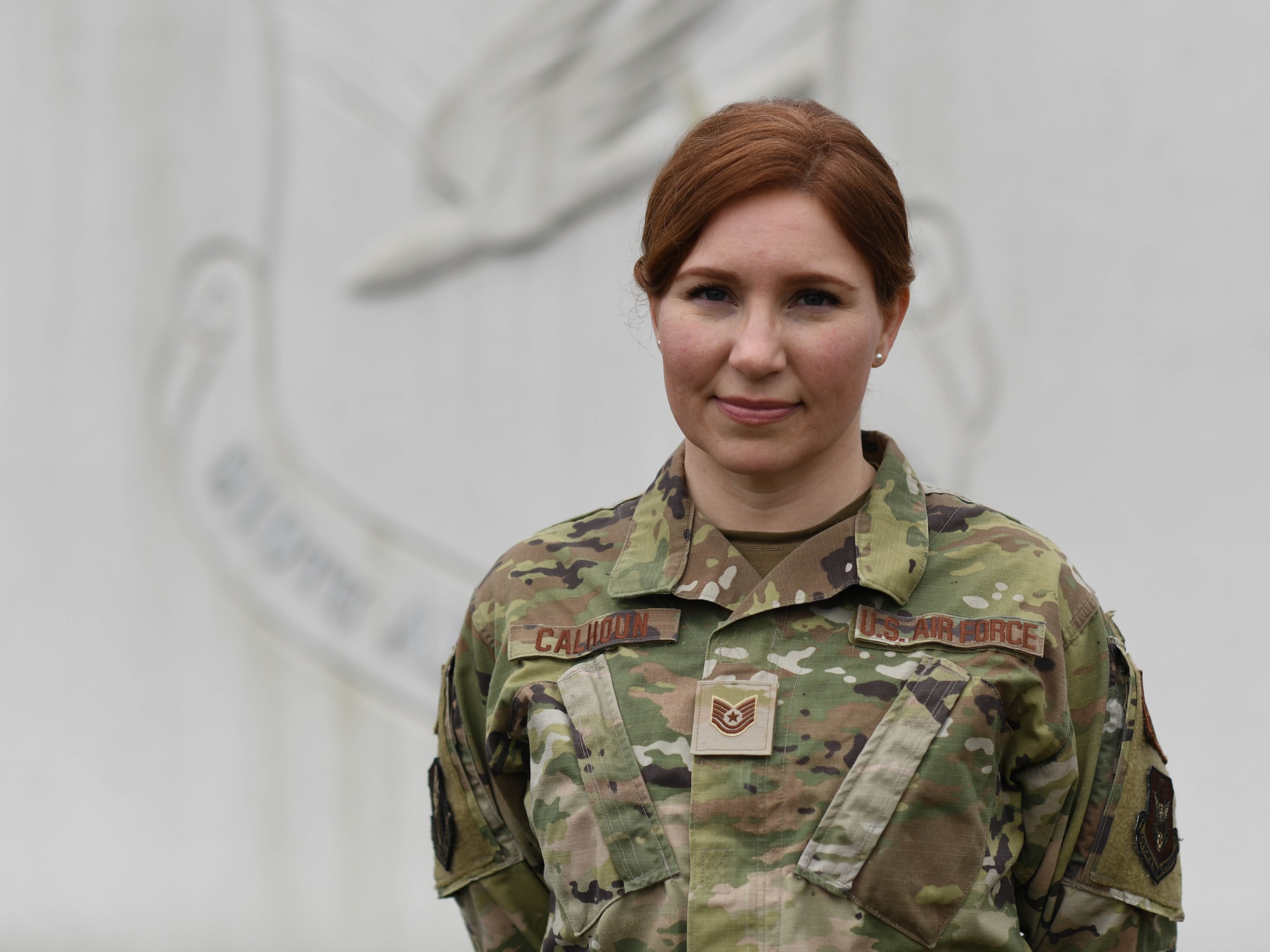 Tech. Sgt. Stacy Calhoun, religious affairs Airman, poses for a photo at the entrance to Youngstown Air Reserve Station, Ohio, on March 2, 2024.