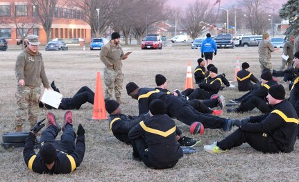 Members of U.S. Army Medical Logistics Command and the U.S. Army Medical Materiel Agency take part in an early-morning PT session and fitness challenge in observance of the Army Medical Department's Enlisted Medical Corps birthday March 1 at Fort Detrick, Maryland. The friendly competition included several relay team events across 137 meters, symbolizing the 137th anniversary, on Blue & Gray Field. While competing, evaluators asked participants questions about the AMEDD Enlisted Corps history. (Katie Ellis-Warfield)