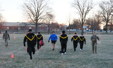 Members of U.S. Army Medical Logistics Command and the U.S. Army Medical Materiel Agency take part in an early-morning PT session and fitness challenge in observance of the Army Medical Department's Enlisted Medical Corps birthday March 1 at Fort Detrick, Maryland. The friendly competition included several relay team events across 137 meters, symbolizing the 137th anniversary, on Blue & Gray Field. While competing, evaluators asked participants questions about the AMEDD Enlisted Corps history. (Katie Ellis-Warfield)