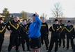 Command Sgt. Maj. Gabriel Wright, center, senior enlisted adviser of U.S. Army Medical Logistics Command, addresses the participants of an early-morning PT session and fitness challenge in observance of the Army Medical Department's Enlisted Medical Corps birthday March 1 at Fort Detrick, Maryland. The friendly competition included several relay team events across 137 meters, symbolizing the 137th anniversary, on Blue & Gray Field. While competing, evaluators asked participants questions about the AMEDD Enlisted Corps history. (Katie Ellis-Warfield)