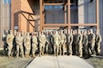 Battalion command teams, from across the 85th U.S. Army Reserve Support Command, pause for a photo during the 85th USARSC three-day BN CMD Teams Training event in Arlington Heights, Illinois, March 3, 2024, to learn about the budgeting process, mobilization and other key issues across the command.