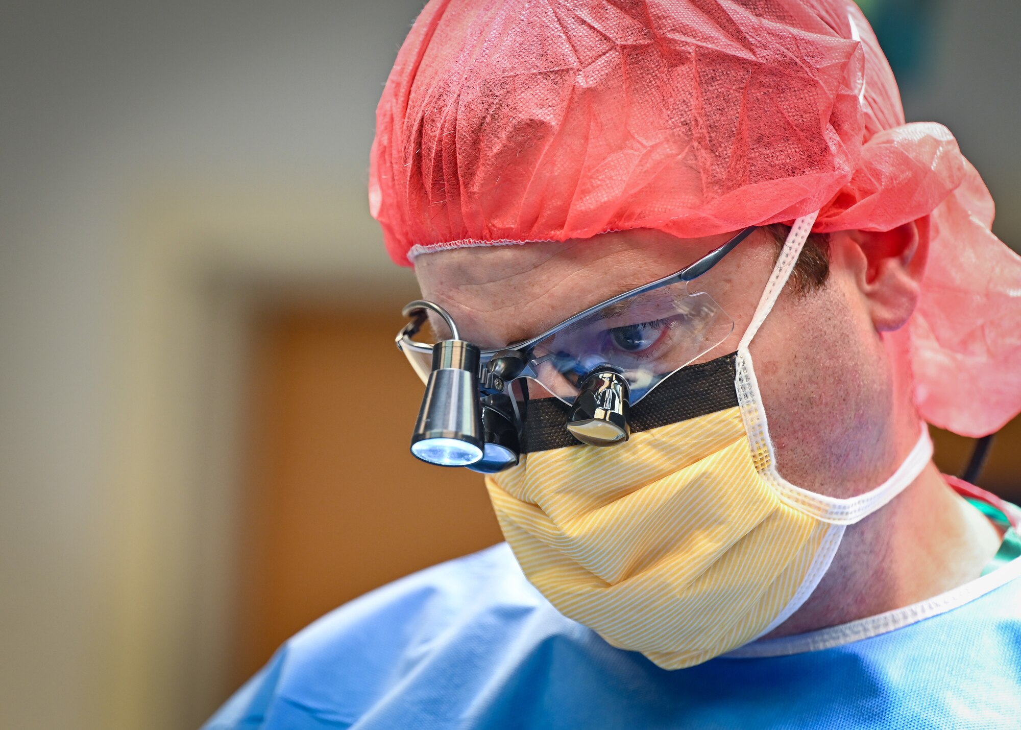 U.S. Air Force Lt. Col. AJ Davidson, 60th Medical Group vascular surgeon, prepares for Augustus Wayne Amos’ surgery at Owen King European Union Hospital, Castries, St. Lucia, Feb. 26, 2024. Davidson said he felt grateful for Amos trusting his team of medical personnel to provide him with the care he needed. U.S. Air Force photo by Staff Sgt. Madeline Herzog