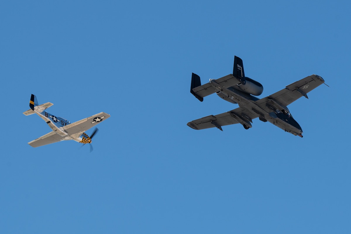 An A-10C Thunderbolt II aircraft flies alongside a P-51 Mustang aircraft during the Heritage Flight Training Course at Davis-Monthan Air Force Base, Ariz., Feb. 29, 2024. Heritage flights were flown with past and current U.S. Air Force aircraft to honor the past, present and future of American airpower. (U.S. Air Force photo by Airman 1st Class Jasmyne Bridgers-Matos)