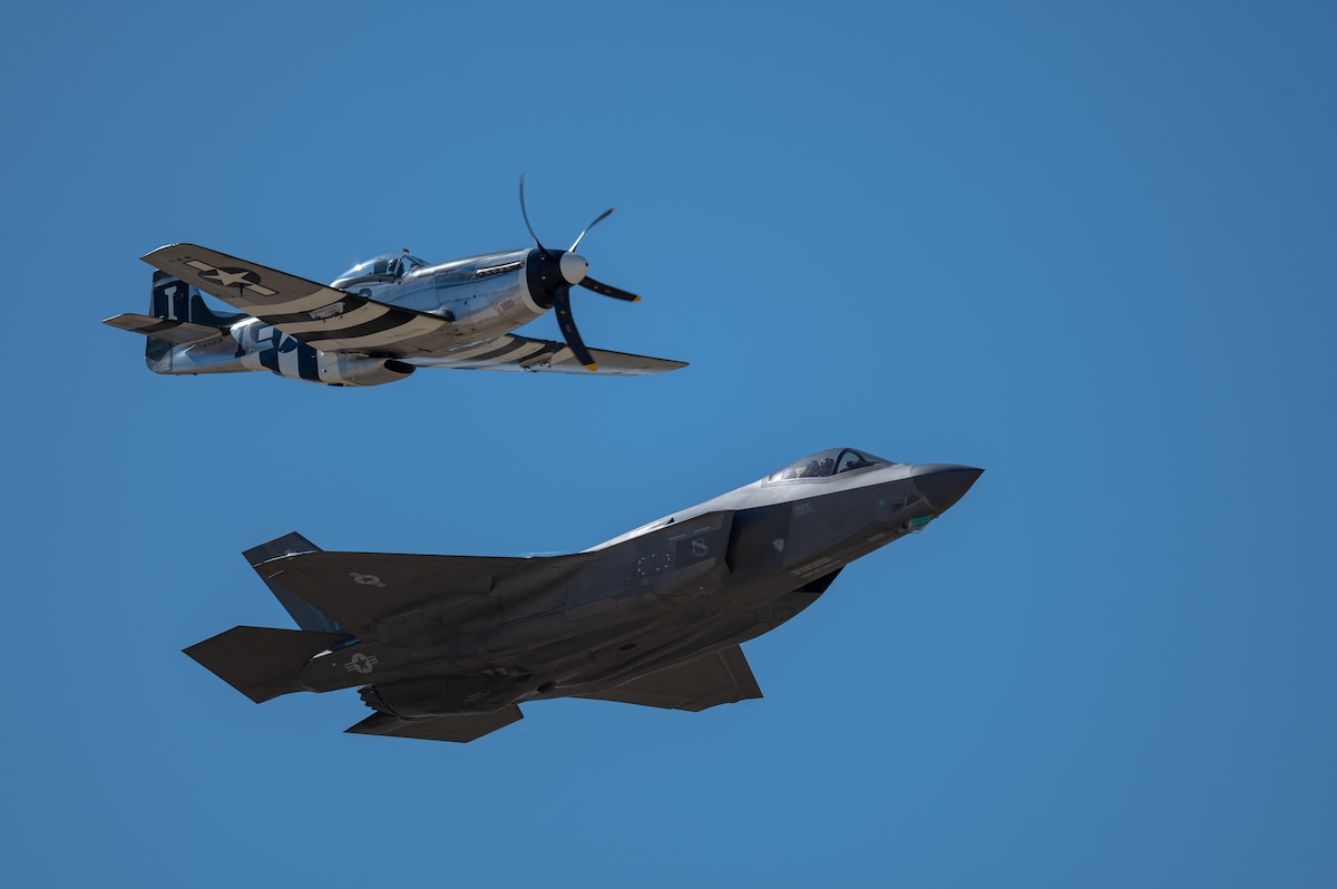 An F-35A Lightning II aircraft flies alongside a P-51 Mustang aircraft during the Heritage Flight Training Course at Davis-Monthan Air Force Base, Ariz., March 1, 2024. During HFTC, aircrew practiced ground and flight training to enable civilian pilots of historic military aircraft and U.S. Air Force pilots of current fighter aircraft to fly safely in formations together. (U.S. Air Force photo by Airman 1st Class Jasmyne Bridgers-Matos)