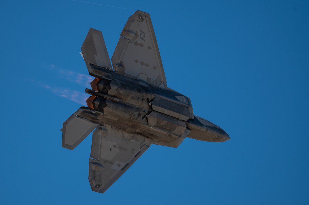 An F-22 Raptor aircraft flies during the Heritage Flight Training Course at Davis-Monthan Air Force Base, Ariz., March 1, 2024. The F-22 Demonstration Team flew at air shows around the globe, performing air demonstrations that include the power loop, split, tail slide, as well as a high speed pass and dedication pass. (U.S. Air Force photo by Airman 1st Class Jasmyne Bridgers-Matos)