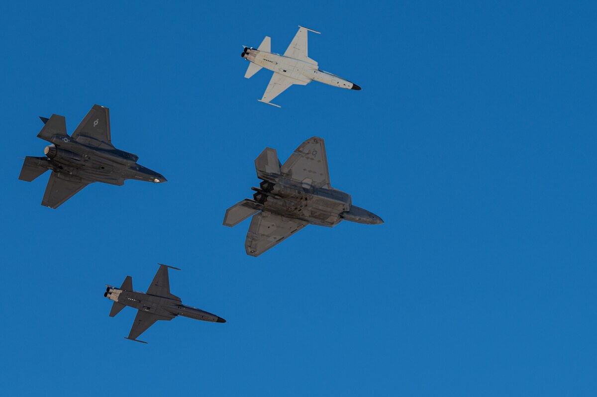 An F-22 Raptor aircraft, an F-35A Lightning II aircraft and two F-5 Tiger aircraft fly in formation during the Heritage Flight Training Course at Davis-Monthan Air Force Base, Ariz., March 3, 2024. Heritage flights were flown with past and current U.S. Air Force aircraft to honor the past, present and future of American airpower. (U.S. Air Force photo by Airman 1st Class Jasmyne Bridgers-Matos)