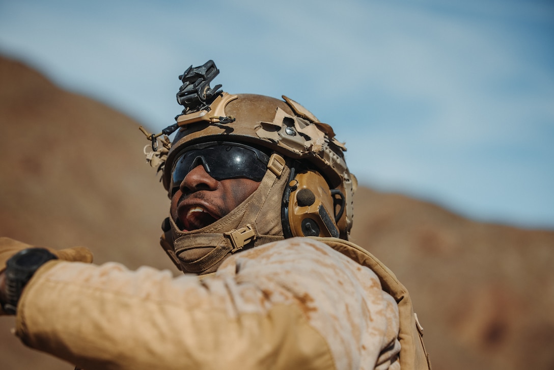 U.S. Marine Corps Lance Cpl. Nehemiah Hampton, a Columbia, South Carolina native, infantry Marine with Charlie Company, 1st Battalion, 4th Marine Regiment, 1st Marine Division, yells for assistance during a Marine Air-Ground Task Force Distributed Maneuver Exercise as part of Service Level Training Exercise 2-24 at Marine Corps Air-Ground Combat Center, Twentynine Palms, California, Feb. 15, 2024. MDMX is designed to test the MAGTF’s operational capabilities in austere, multi-domain, offensive and defensive operations against adversaries at a regimental level. (U.S. Marine Corps photo by Lance Cpl. Justin J. Marty)