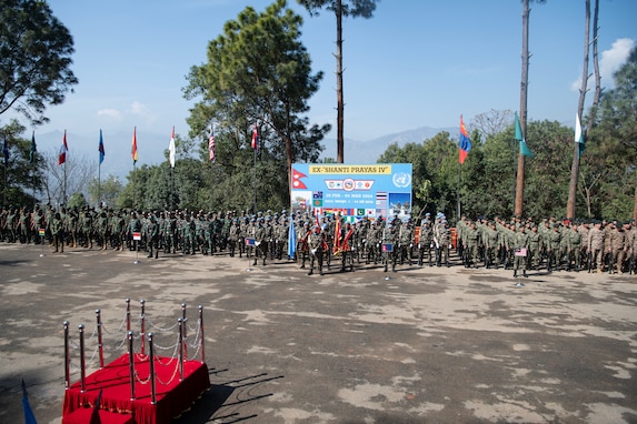 Combined service members from 18 countries participate in the closing ceremony of Exercise Shanti Prayas IV at the Birendra Peace Operations Centre parade field on March 4, 2024. Shanti Prayas IV is a multinational peacekeeping exercise sponsored by the Nepali Army and U.S. Indo-Pacific Command and is the latest in a series of exercises designed to support peacekeeping operations. (U.S. Marine Corps photo by Lance Cpl John Hall)