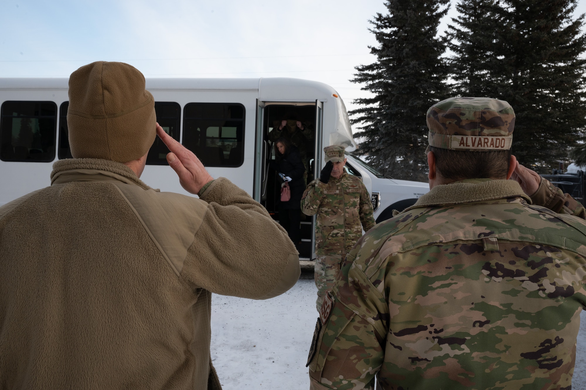 U.S. Air Force Col. Antonio Alvarado (right), 354th Mission Support Group commander, and Master Sgt. Adam Spencer (left), 354th Civil Engineering Squadron, unaccompanied housing superintendent, greets Gen. Kevin Schneider, Pacific Air Forces commander, to discuss unaccompanied housing struggles at Eielson Air Force Base, Alaska, Feb. 29, 2024. Eielson currently has eight dormitories that support unaccompanied Airmen at the rank of E4 and below. (U.S. Air Force photo by Airman Spencer Hanson)