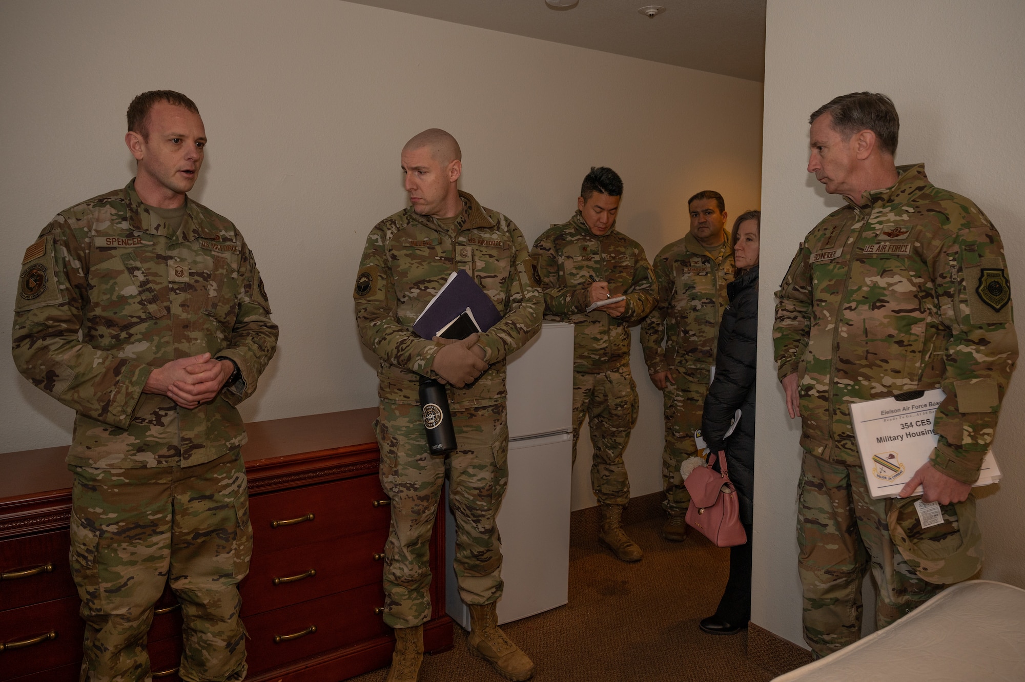 U.S. Air Force Master Sgt. Adam Spencer (left), 354th Civil Engineering Squadron, unaccompanied housing superintendent, briefs Gen. Kevin Schneider, Pacific Air Forces commander, on challenges unaccompanied Airmen may face while living in Alaska, at Eielson Air Force Base, Alaska, Feb. 29, 2024. The dormitories provide lodging for unaccompanied Airmen at the rank of E4 and below and supports 780 Airmen on base. (U.S. Air Force photo by Airman Spencer Hanson)