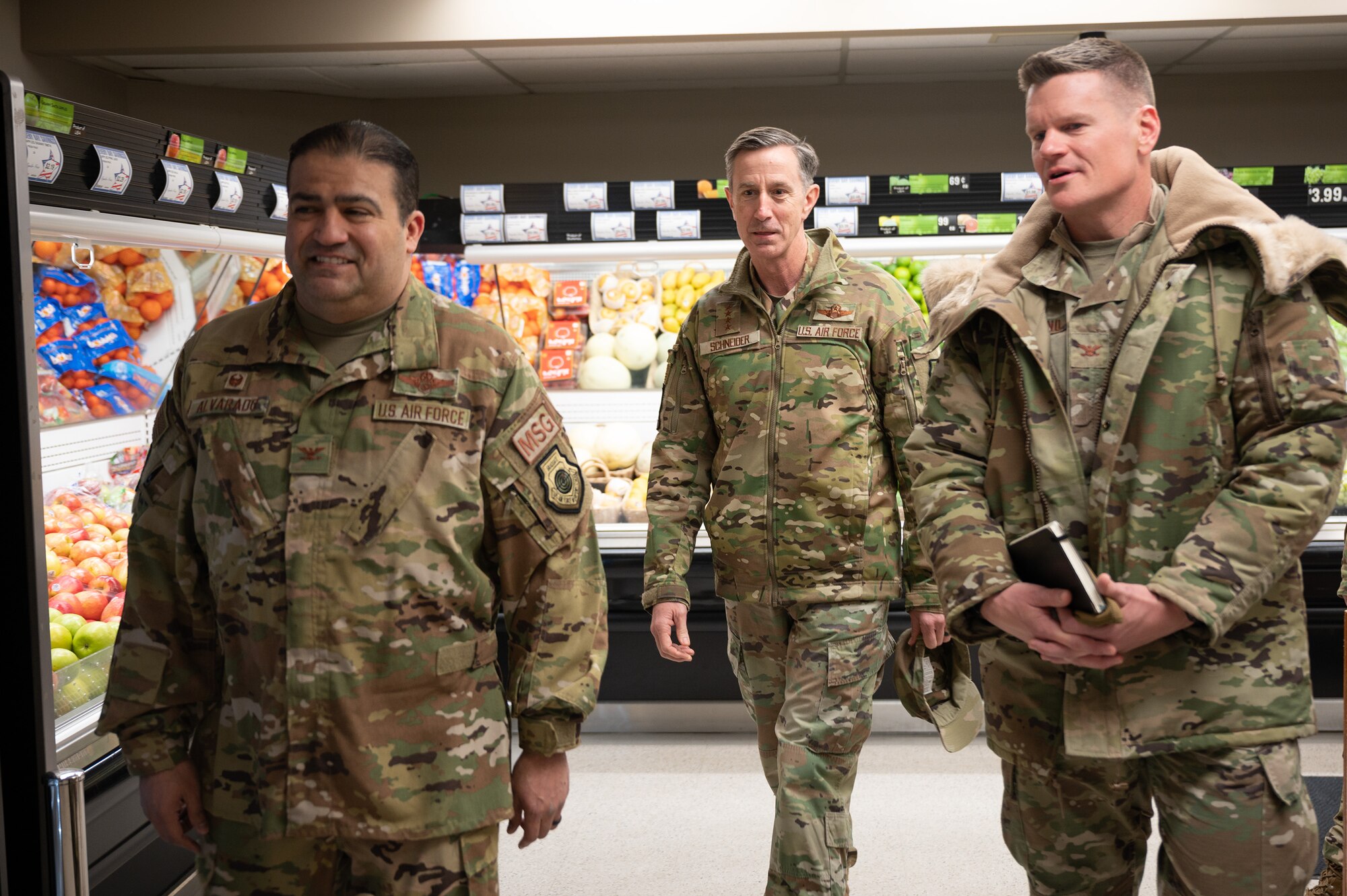 U.S. Air Force Col. Antonio Alvarado (left), 354th Mission Support Group commander, Gen. Kevin Schneider (middle), Pacific Air Forces commander, and Col. Paul Townsend (right), 354th Fighter Wing commander, tour the commissary at Eielson Air Force Base, Alaska, Feb. 29, 2024. The commissary feeds 3,700 active-duty Airmen and their families at Eielson AFB. (U.S. Air Force photo by Airman Spencer Hanson)