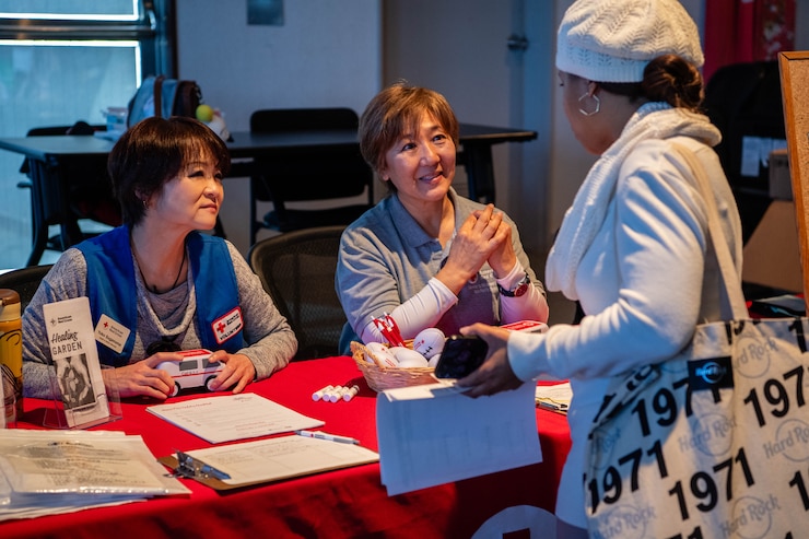 Members of Team Yokota participate in an employment and volunteer recruitment fair at the Military and Family Readiness Center at Yokota Air Base, Japan.