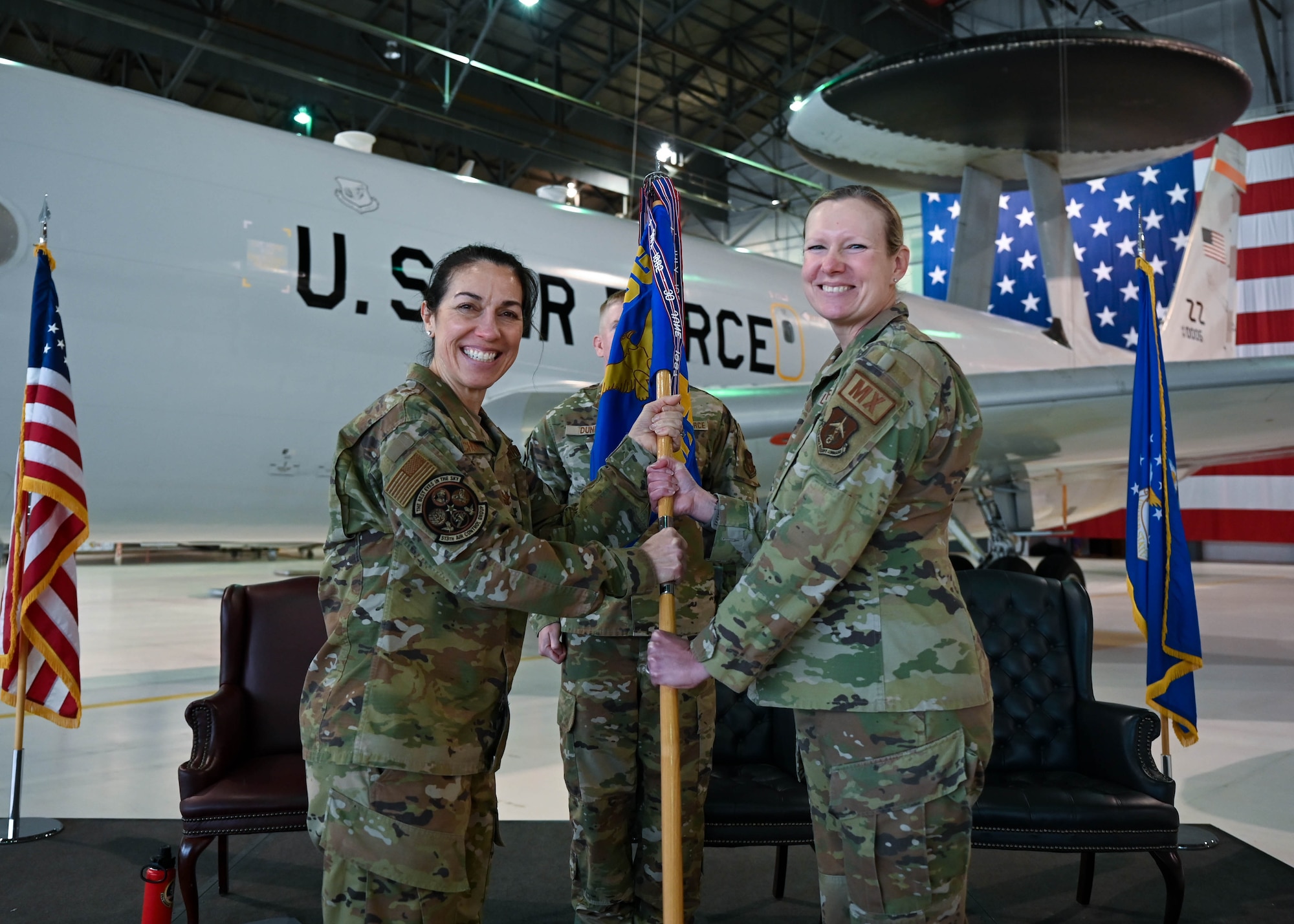 Command guidon and two Airmen