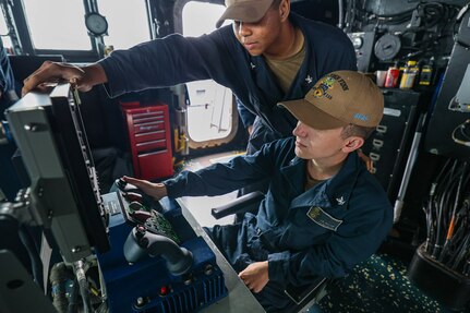 TAIWAN STRAIT (March 5, 2024) Gunners Mate 3rd Class Joseph Braam, right, from Bemidji, Minnesota, and Gunners Mate 2nd Class T.J. Nguyen, from Houston, Texas, stand watch aboard the Arleigh Burke-class guided-missile destroyer USS John Finn (DDG 113) during a transit through the Taiwan Strait, March 5. John Finn is forward-deployed and assigned to Destroyer Squadron (DESRON) 15, the Navy’s largest DESRON and the U.S. 7th Fleet’s principal surface force. (U.S. Navy photo by Mass Communication Specialist 2nd Class Justin Stack)