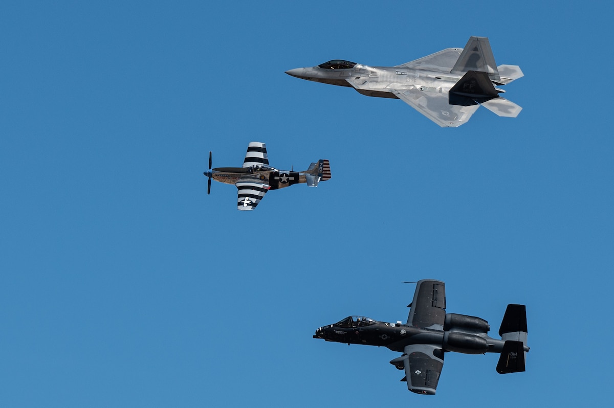 An F-22 Raptor, A-10C Thunderbolt II and a P-51 Mustang aircraft fly in formation during the Heritage Flight Training Course at Davis-Monthan Air Force Base, Ariz., March 2, 2024. During HFTC, aircrew practiced ground and flight training to enable civilian pilots of historic military aircraft and U.S. Air Force pilots of current fighter aircraft to fly safely in formations together. (U.S. Air Force photo by Airman 1st Class Jasmyne Bridgers-Matos)