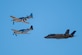 An F-35A Lightning II flies alongside two P-51 Mustang aircraft during the Heritage Flight Training Course at Davis-Monthan Air Force Base, Ariz., March 2, 2024. Heritage flights were flown with past and current U.S. Air Force aircraft to honor the past, present and future of American airpower. (U.S. Air Force photo by Airman 1st Class Jasmyne Bridgers-Matos)