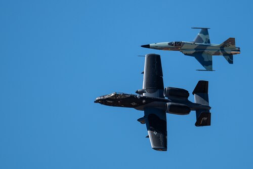 An A-10C Thunderbolt II aircraft flies alongside an F-5 Tiger aircraft during the Heritage Flight Training Course at Davis-Monthan Air Force Base, Ariz., March 1, 2024. During HFTC, aircrew practiced ground and flight training to enable civilian pilots of historic military aircraft and U.S. Air Force pilots of current fighter aircraft to fly safely in formations together. (U.S. Air Force photo by Airman 1st Class Jasmyne Bridgers-Matos)
