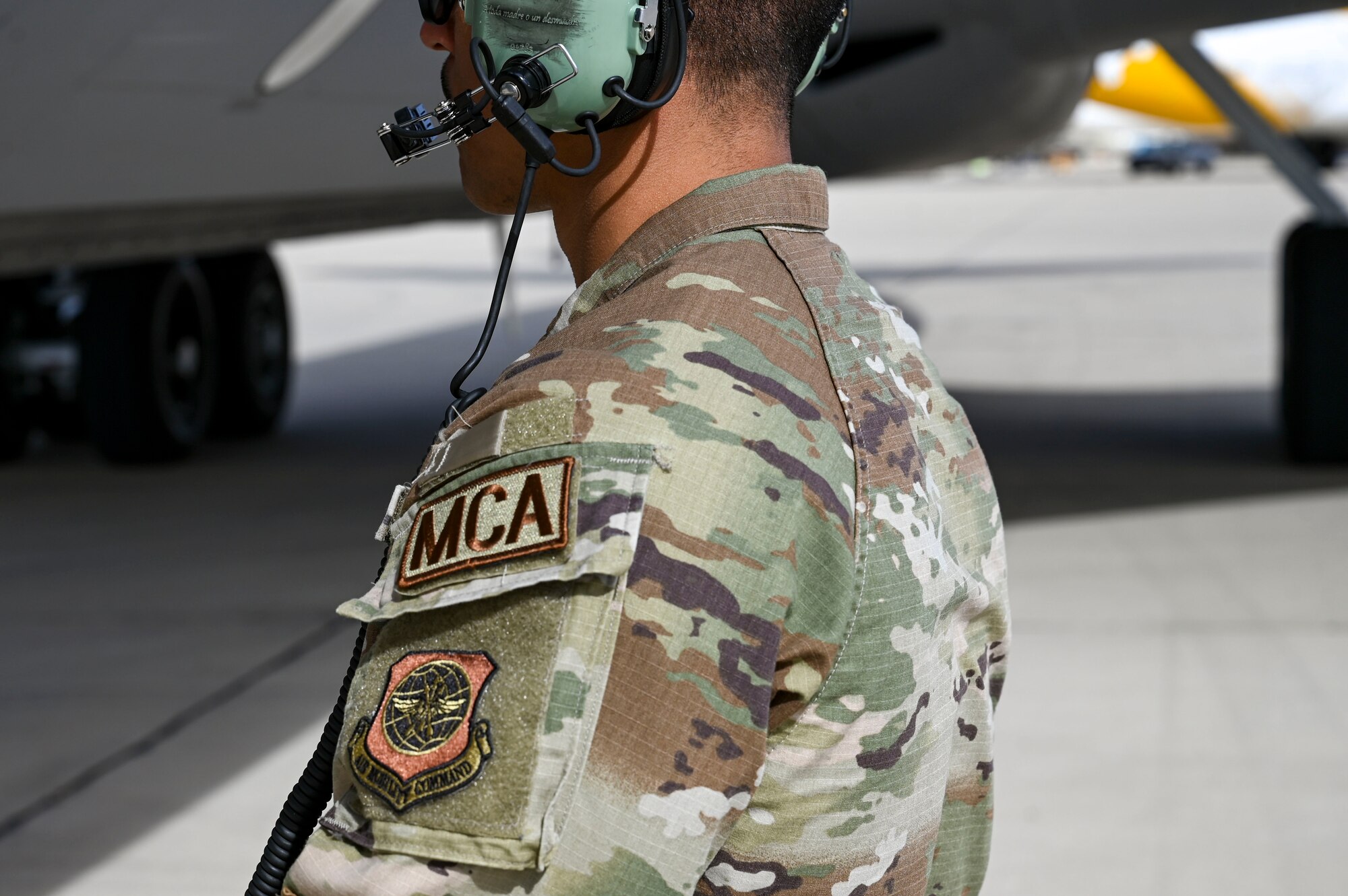 An Airman stands by a jet.