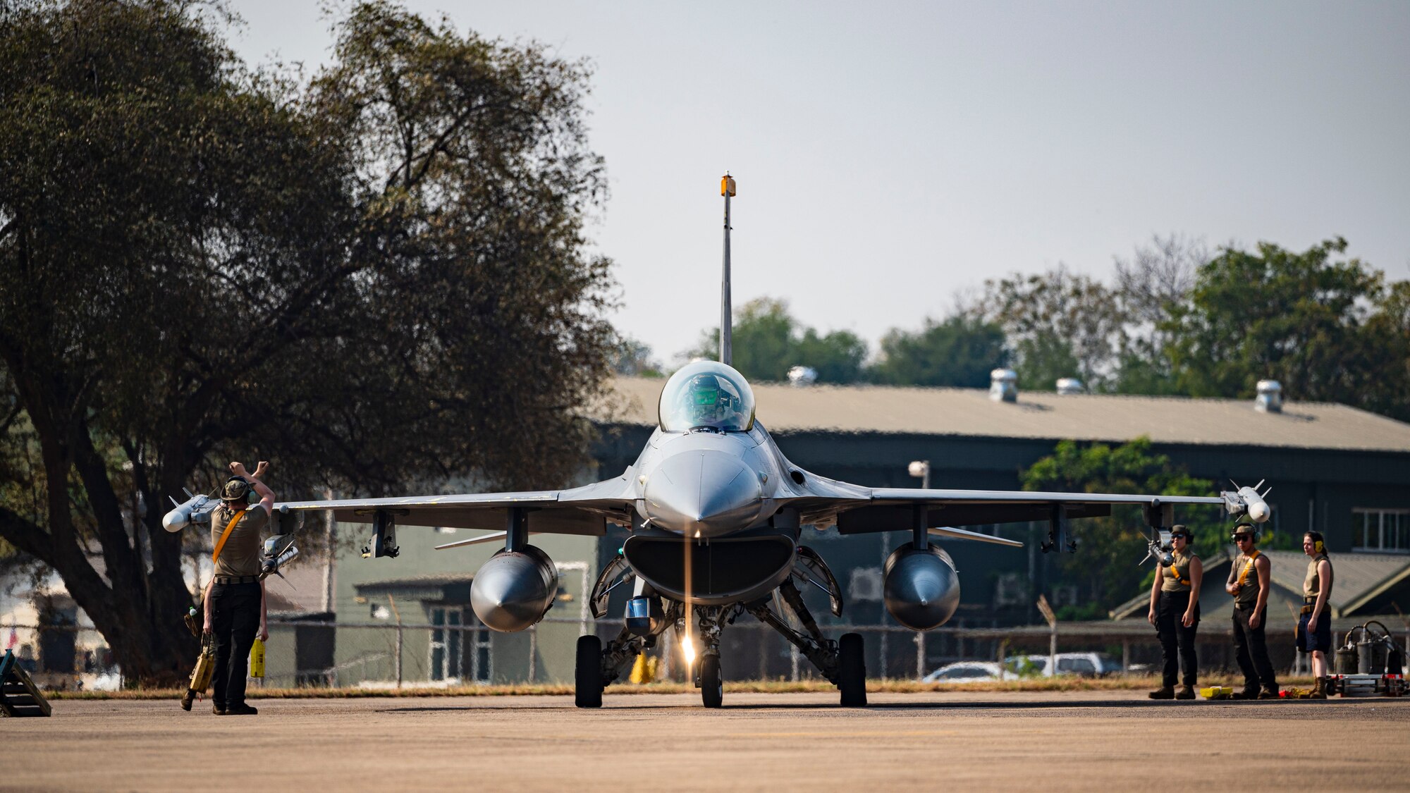 Members from the 80th Fighter Generation Squadron provide maintenance support for the departure of an F-16 Fighting Falcon