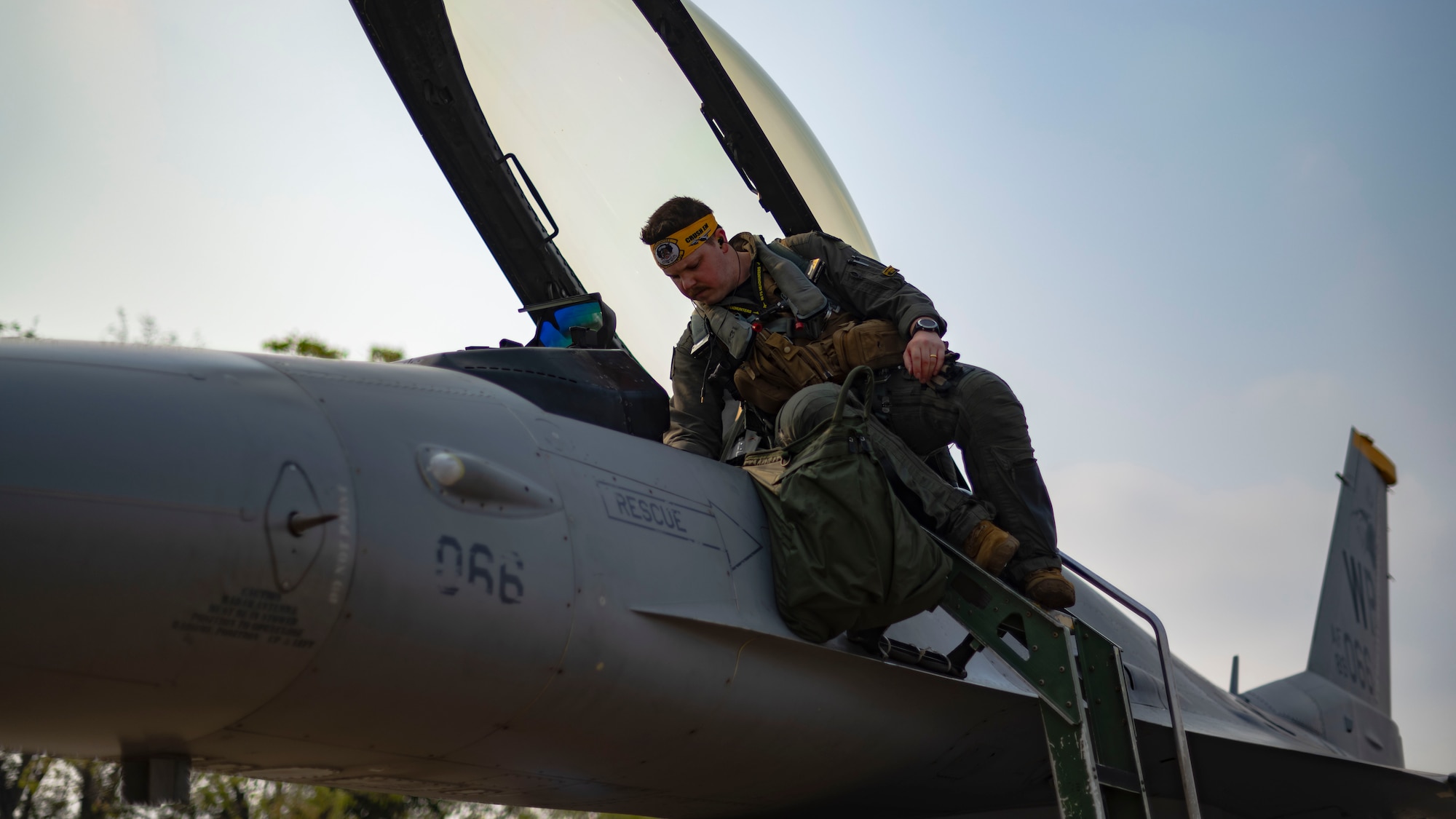 An F-16 Fighting Falcon pilot, boards an aircraft to lead U.S. Air Force integration into an amphibious assault scenario