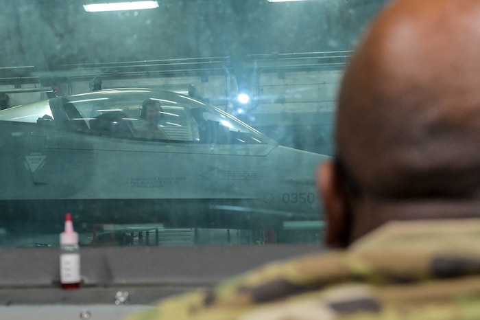 An Airman gives feedback.