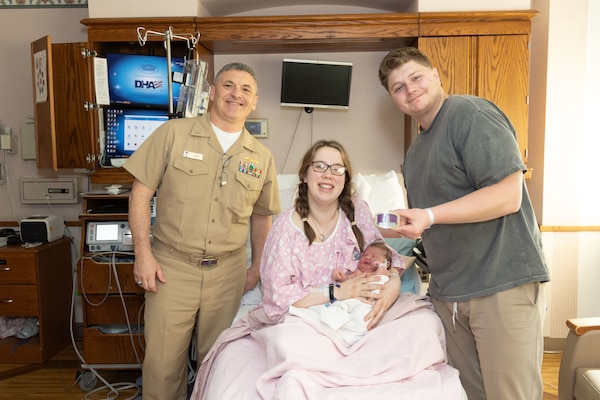 Capt. David G. Lang, a leap year baby himself, presents leap year babies and their parents a gift for being born on Feb. 29, 2024 at Walter Reed. A leap year is a calendar year that contains an additional day compared to a common year. (DOD photo by Ricardo J. Reyes)