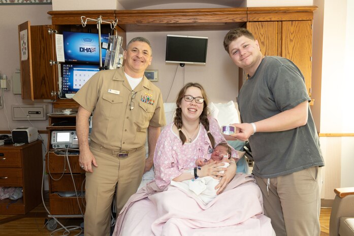 Capt. David G. Lang, a leap year baby himself, presents leap year babies and their parents a gift for being born on Feb. 29, 2024 at Walter Reed. A leap year is a calendar year that contains an additional day compared to a common year. (DOD photo by Ricardo J. Reyes)