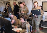 U.S. Air Force air battle managers and tactical air control-party Airmen experiment with Air Combat Command’s Tactical Operations Center-enabled Control Reporting Center during the Shadow Operations Center – Nellis’ Capstone event at Nellis Air Force Base, Nevada, Dec. 8, 2023.