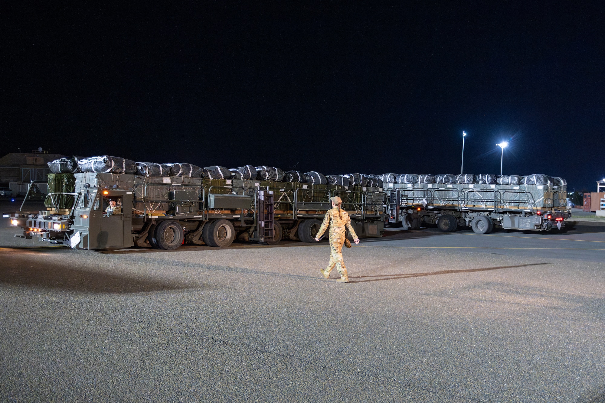 K-loaders filled with pallets of Halal meals destined for an airdrop over Gaza are readied for load onto a U.S. Air Force C-130J Super Hercules.
