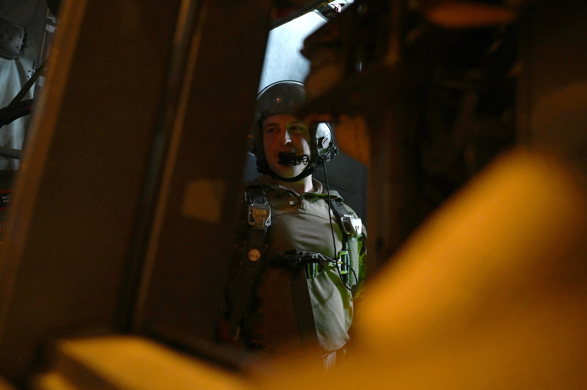 A loadmaster prepares to release pallets of humanitarian aid via airdrop from a C-130J over Gaza.