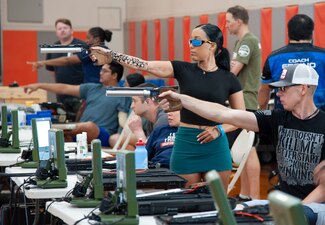 Athletes compete in the Navy Wounded Warrior shooting trials at the Pierside Fitness Center at  Joint Base Pearl Harbor-Hickam