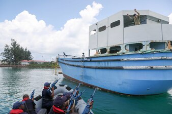 A Kenyan visit, board, search and seizure team prepares to board a vessel during exercise scenarios as part of Cutlass Express.