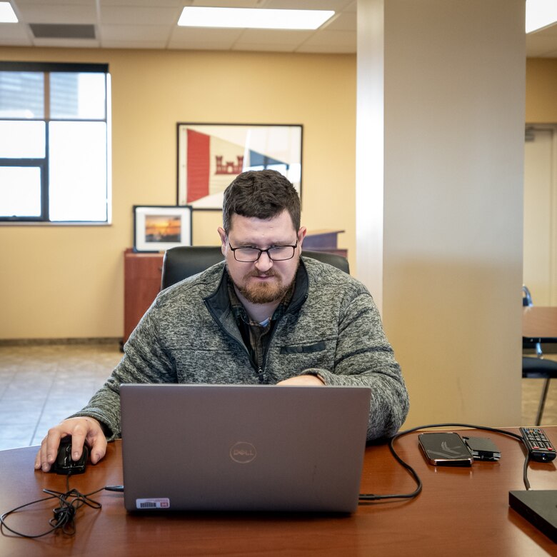 U.S. Army Corps of Engineers, Buffalo District intern, Scott Poffenberger works to complete his onboarding information as he begins his employment at the Cleveland Project Office while continuing his education at Cleveland State University, Cleveland, Ohio, Feb. 20, 2024.