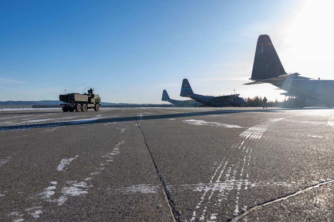 U.S. Marines with Fox Battery, 2nd Battalion, 14th Marine Regiment, 4th Marine Division, Marine Forces Reserve and Marine Aerial Refueler Transport Squadron (VMGR) 234, Marine Aircraft Group 41, 4th Marine Aircraft Wing, Marine Forces Reserve begin onloading a M142 High Mobility Artillery Rocket System (HIMARS) onto a C-130J Hercules during a HIMARS Rapid Infiltration, also known as a HIRAIN, during exercise Arctic Edge 2024 at Eielson Air Force, Alaska, Feb. 24, 2024. The HIRAIN training demonstrated Marine Forces Reserve’s ability to rapidly deploy the HIMARS to meet and deter any threats in any environment, including harsh arctic environments. Arctic Edge 2024 (AE24) is a U.S. Northern Command-led homeland defense exercise demonstrating the U.S. military’s capabilities in extreme cold weather, joint force readiness, and U.S. military commitment to mutual strategic security interests in the arctic region. (U.S. Marine Corps photo by Lance Cpl. Madisyn Paschal)