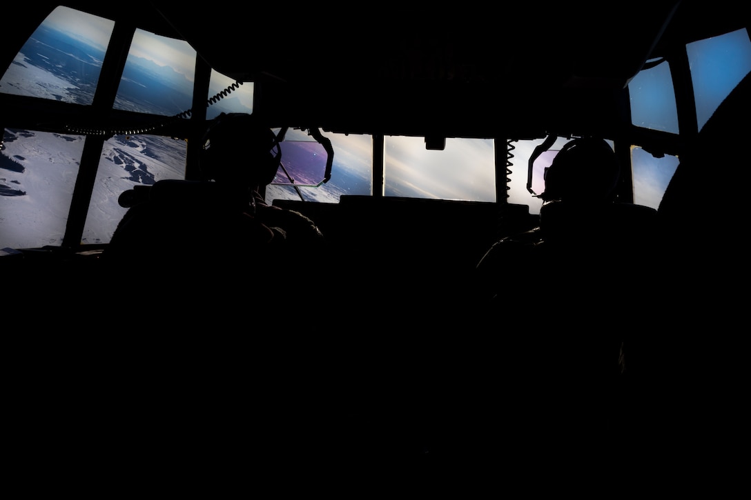 U.S. Marine Corps Capt. Evan Gumbel, a pilot with Marine Aerial Refueler Transport Squadron (VMGR) 234, Marine Aircraft Group 41, 4th Marine Aircraft Wing, Marine Forces Reserve, and Capt. Christopher Keller, co-pilot with VMGR 234, depart inside a C-130J Hercules during a High Mobility Artillery Rocket System (HIMARS) Rapid Infiltration, also known as a HIRAIN, with Fox Battery, 2nd Battalion, 14th Marine Regiment, 4th Marine Division, Marine Forces Reserve during exercise Arctic Edge 2024 at Eielson Air Force, Alaska, Feb. 24, 2024. The HIRAIN training demonstrated Marine Forces Reserve’s ability to rapidly deploy the HIMARS to meet and deter any threats in any environment, including harsh arctic environments. Arctic Edge 2024 (AE24) is a U.S. Northern Command-led homeland defense exercise demonstrating the U.S. military’s capabilities in extreme cold weather, joint force readiness, and U.S. military commitment to mutual strategic security interests in the arctic region. (U.S. Marine Corps photo by Lance Cpl. Madisyn Paschal)